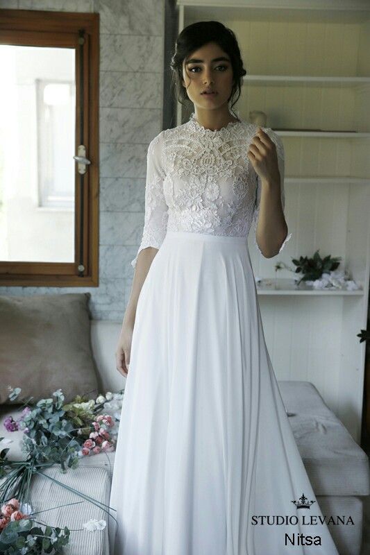 Modest simple wedding gown. Long lace sleeves, flowy skirt .
